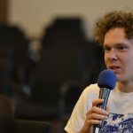 an audience member poses a question