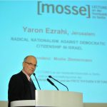 Ezrahi lectures from the podium