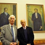 Zimmermann and Ezrahi pose in front of the portraits of the Humboldt brothers