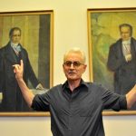 Rose poses in front of the portraits of the Humboldt brothers