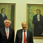 Danuser poses in front of the portraits of the Humboldt brothers