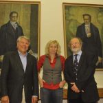 Gebauer, Geipel, and Schild pose in front of the portraits of the Humboldt brothers