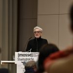 Pauls speaking from the podium