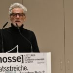 Pauls speaking from the podium