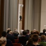 the audience looks on