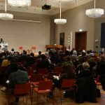 the audience looks on