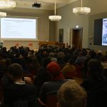 Kaiser lectures to the audience