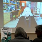 Scheppele addresses the audience remoately