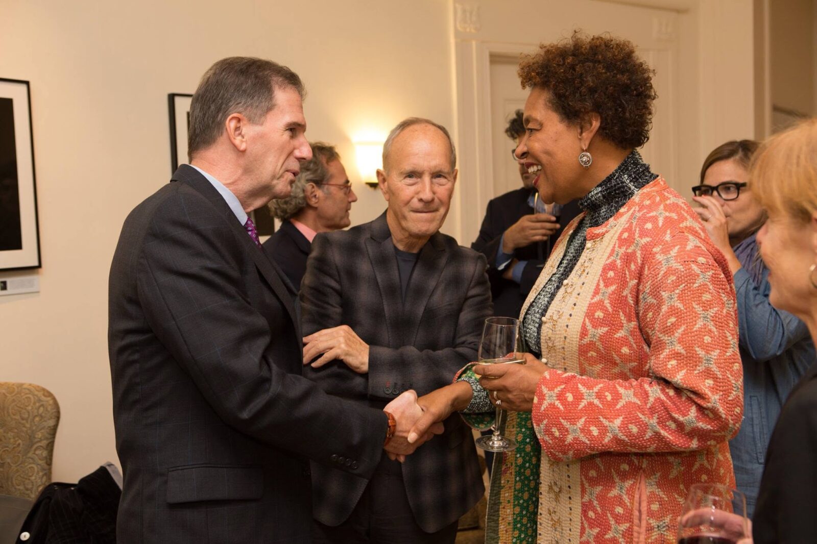 Lesley University President Joseph Moore (left) and Dean Emeritus Stan Trecker speak with Carrie Mae Weems.