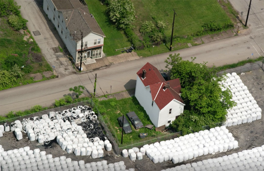 Frazier took this image by helicopter of industrial waste encroaching on a Braddock home.