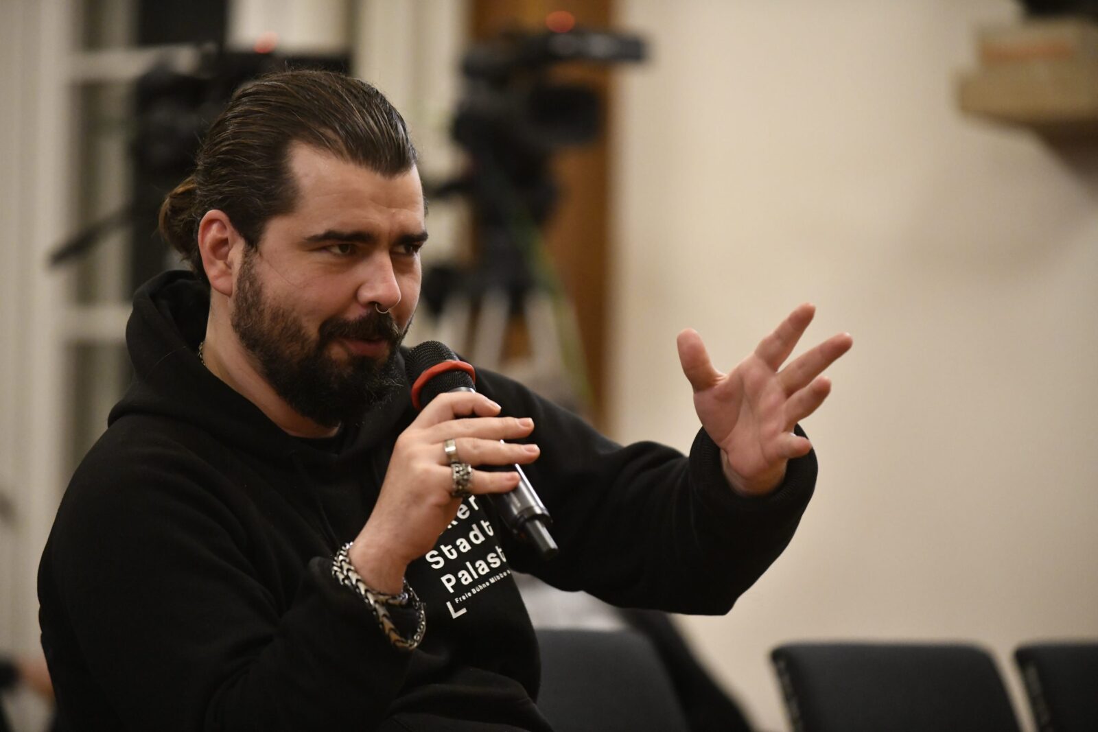 an audience member asks a question