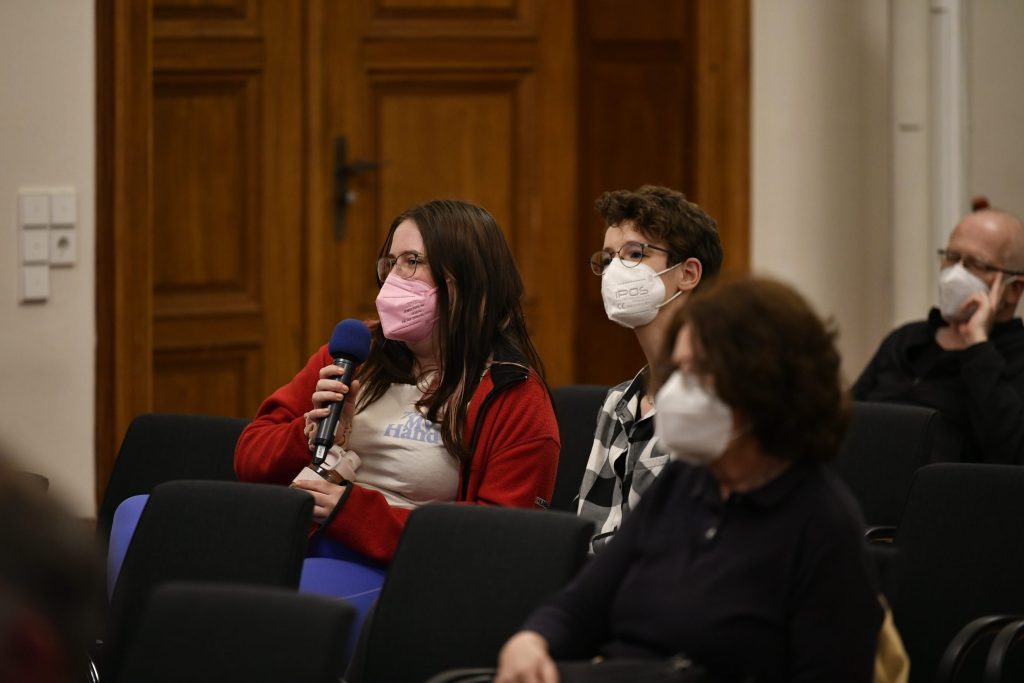 An audience member poses a question