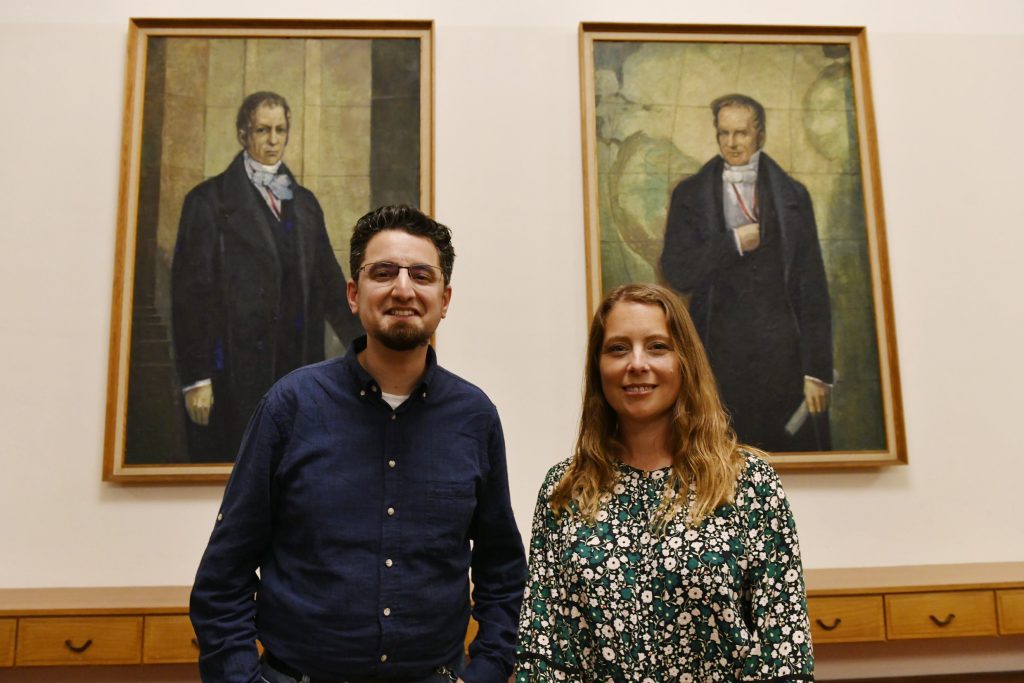 Hannah Cloke and Matthias Kramm with the portraits of the Humboldt brothers