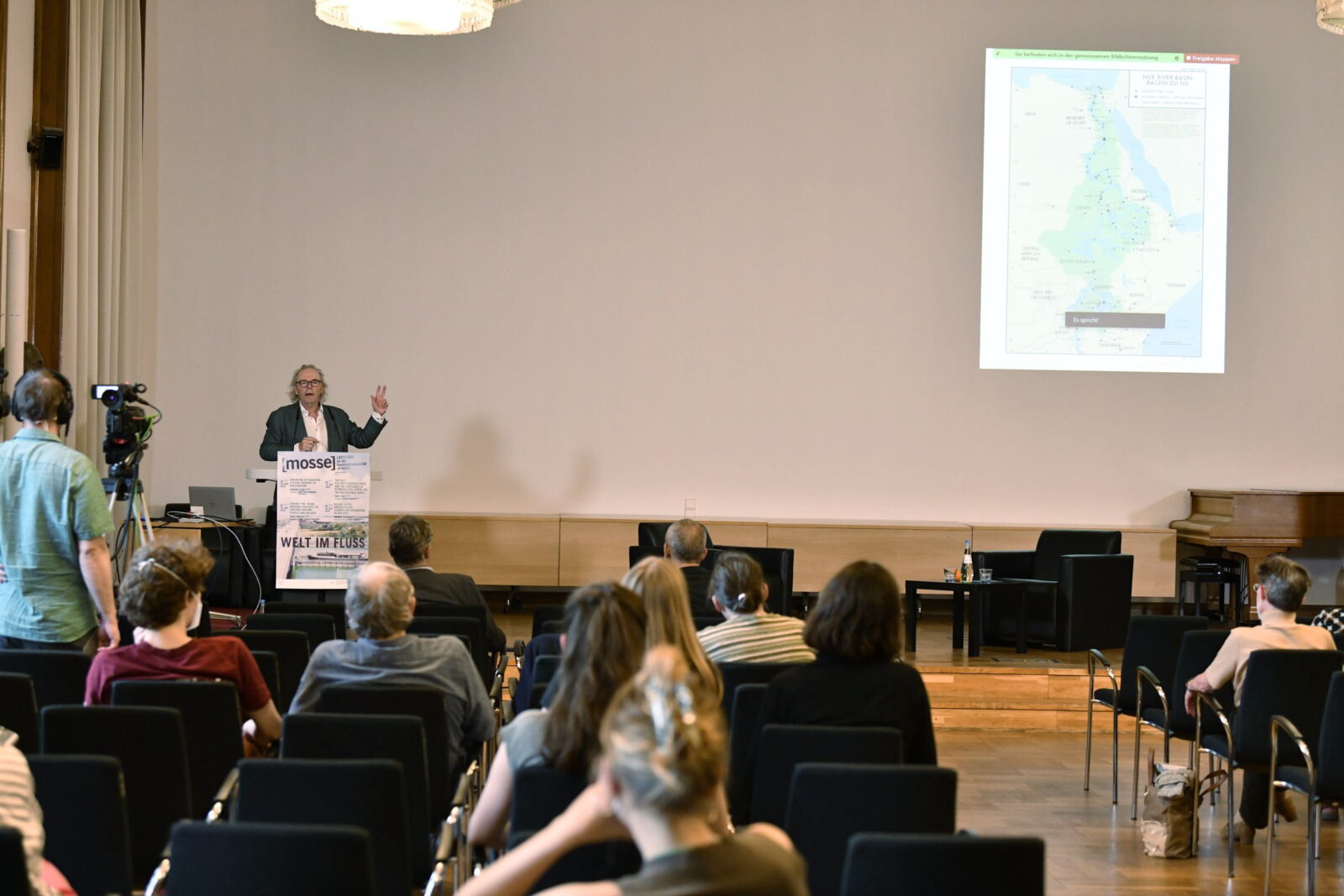 Terje Tvedt lectures at the podium