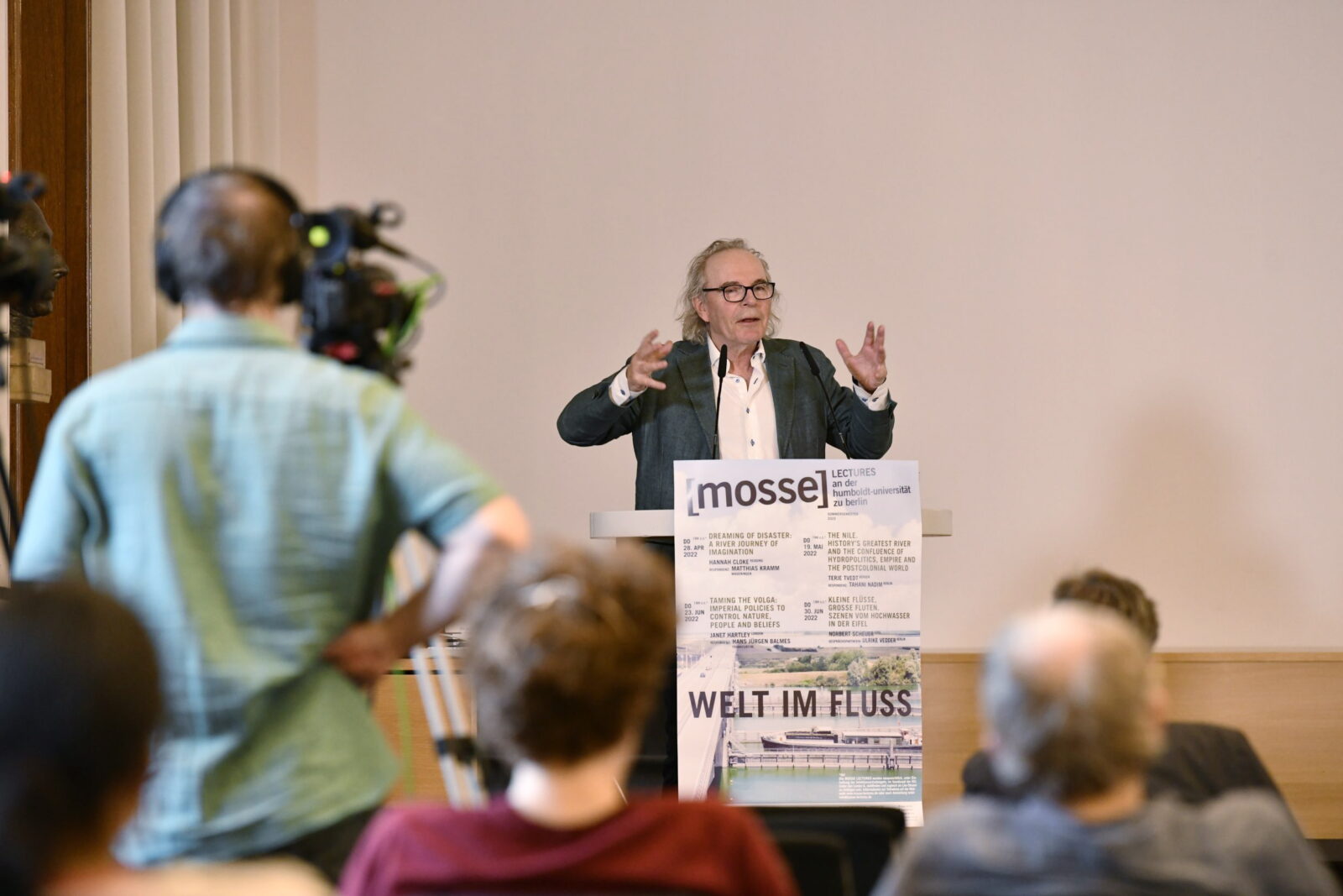 Terje Tvedt lectures at the podium