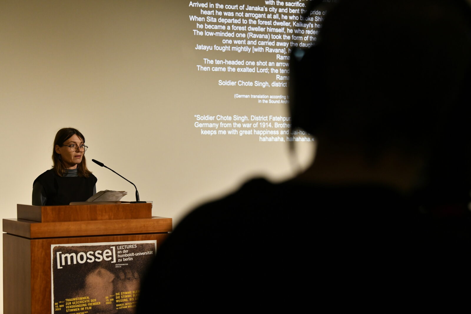 Britta Lange speaks at the podium