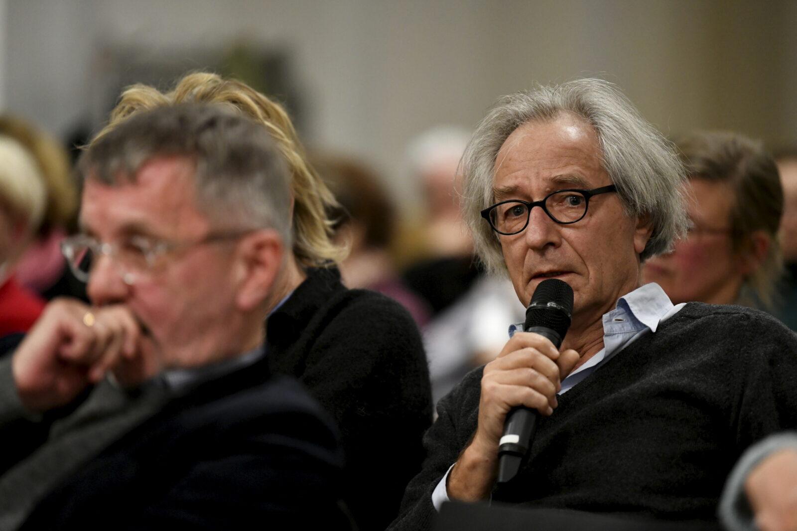 an audience member asks a question