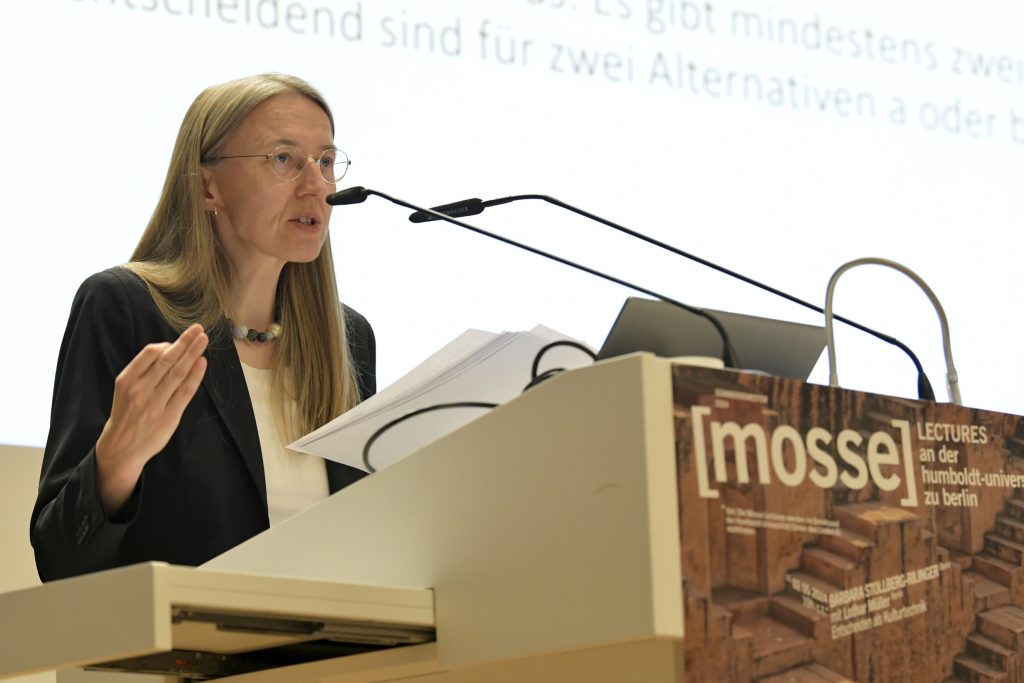 Auer speaking at the podium