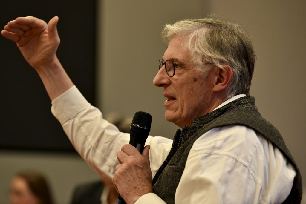 an audience member asks a question