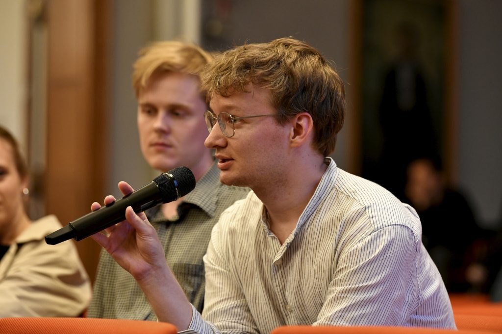 an audience member asks a question
