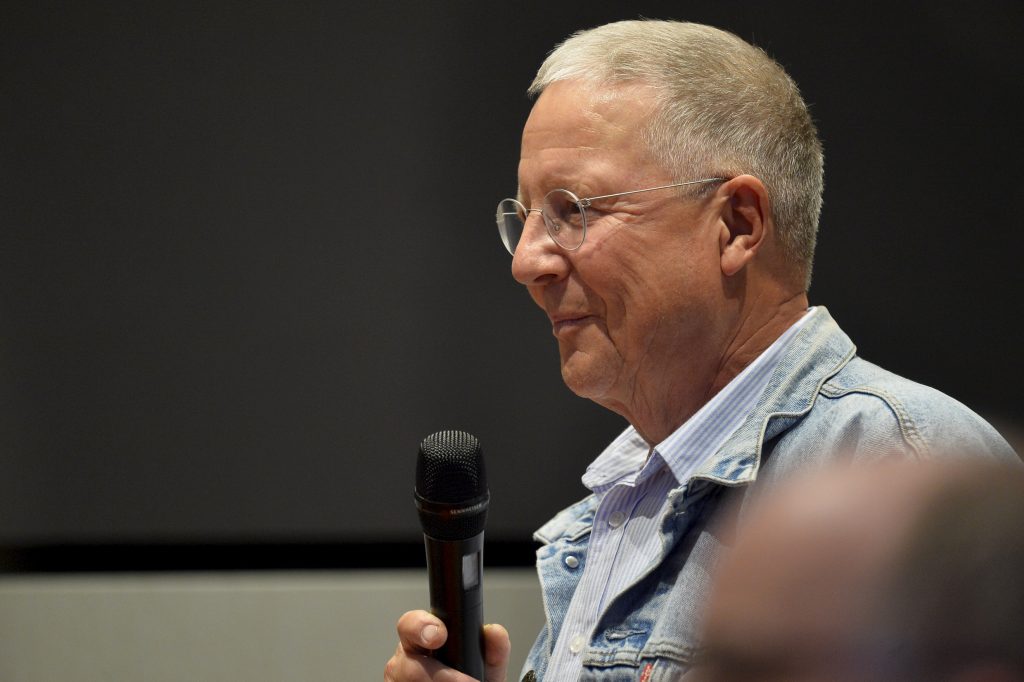 An audience member asks a question