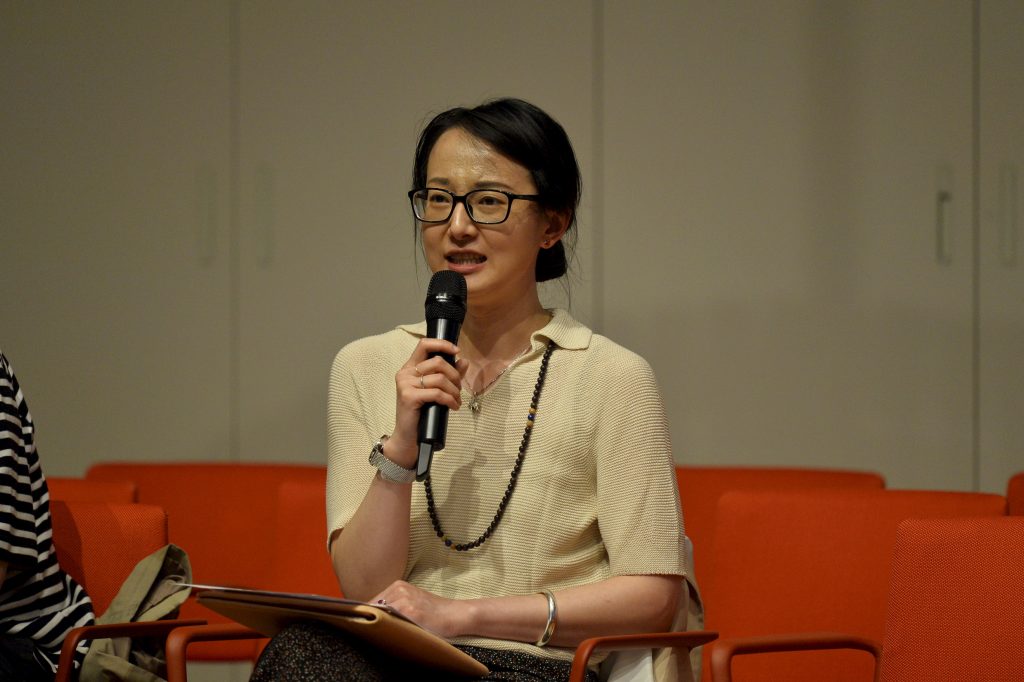 An audience member asks a question