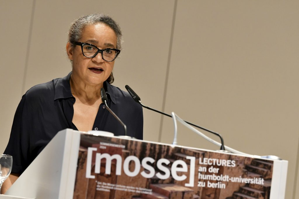 Ethel Matala de Mazza stands at the podium and opens the evening