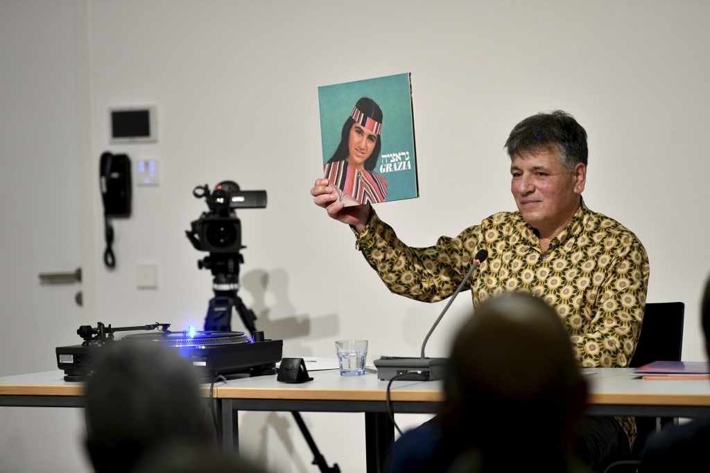Marcel Beyer holds up a record