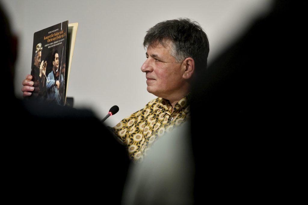 Marcel Beyer holds up a record