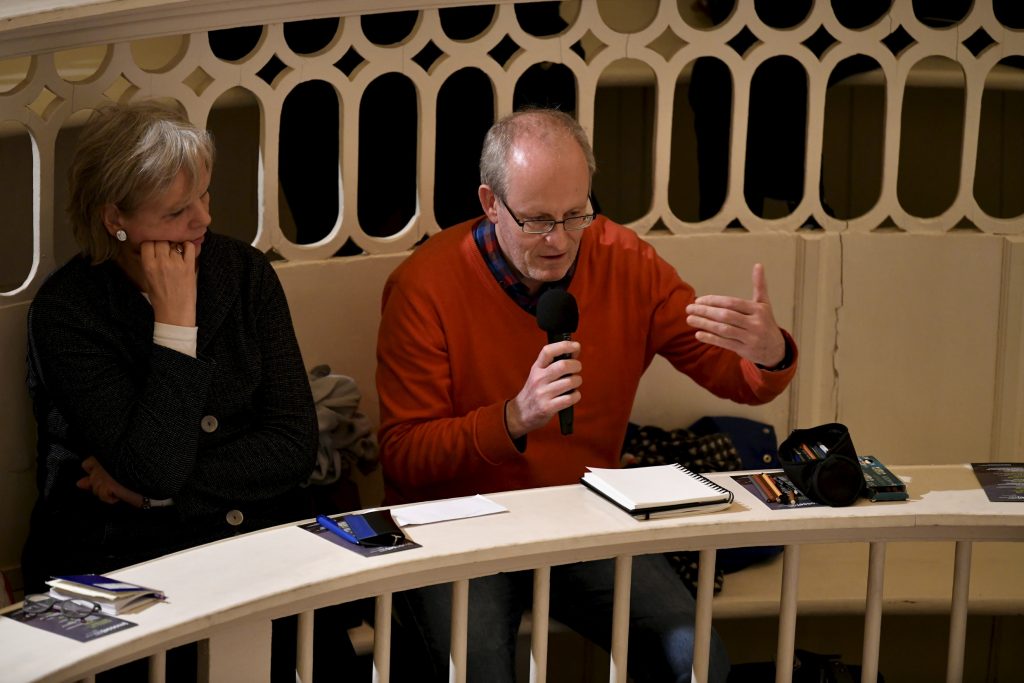 an audience member asks a question