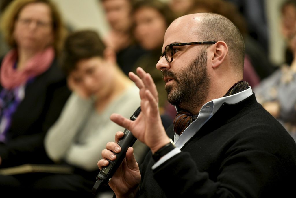 an audience member asks a question