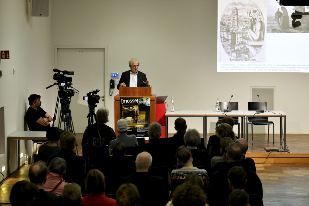 Hartmut Böhme delivering his lecture, with audience in foreground