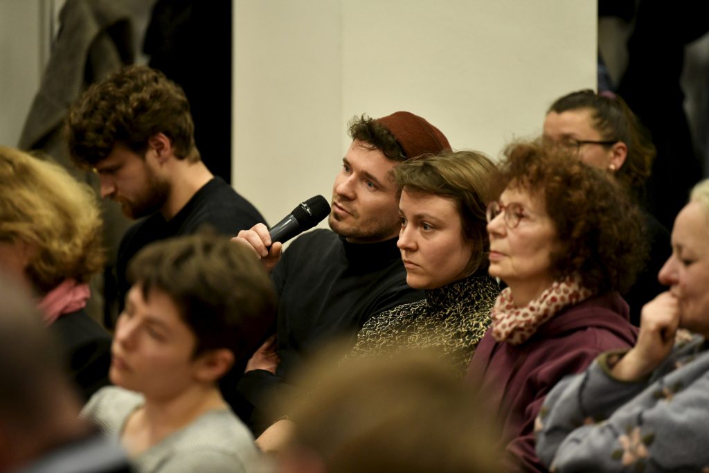 an audience member asks a question