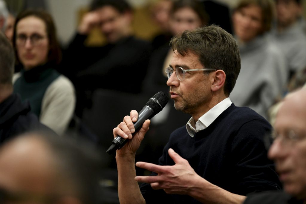 an audience member asks a question