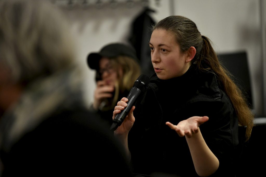 an audience member asks a question