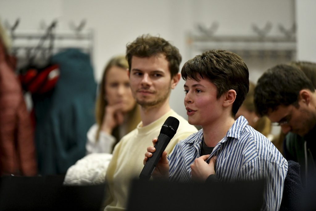 an audience member asks a question