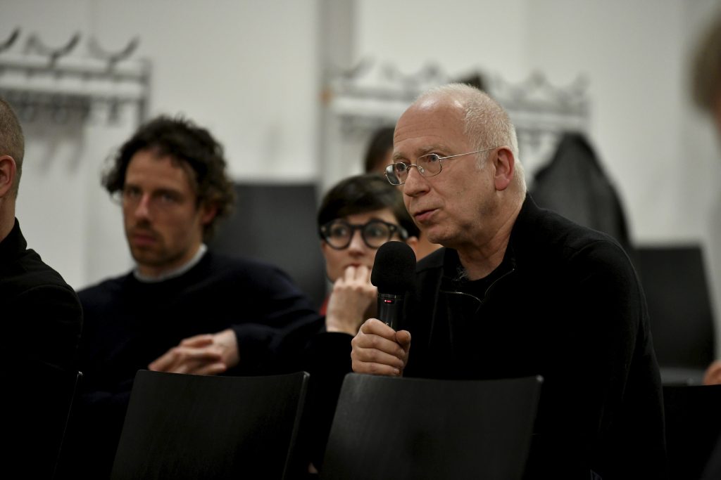 an audience member asks a question