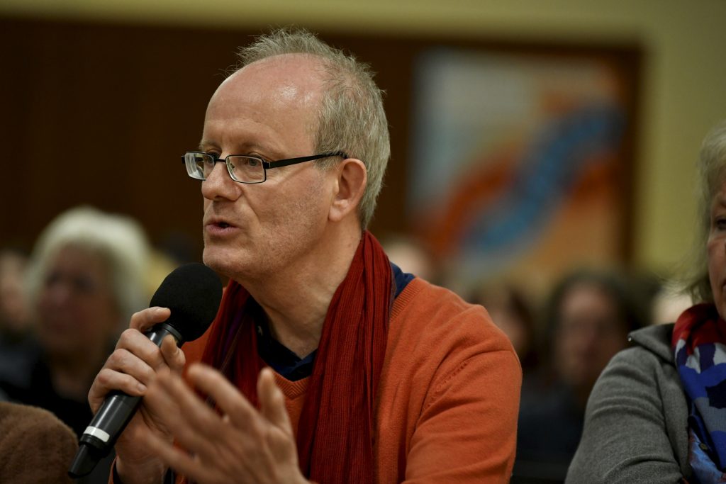 an audience member asks a question