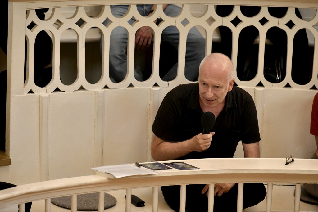 an audience member poses a question