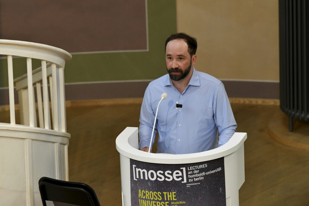 Felix Maschewski speaks at the podium