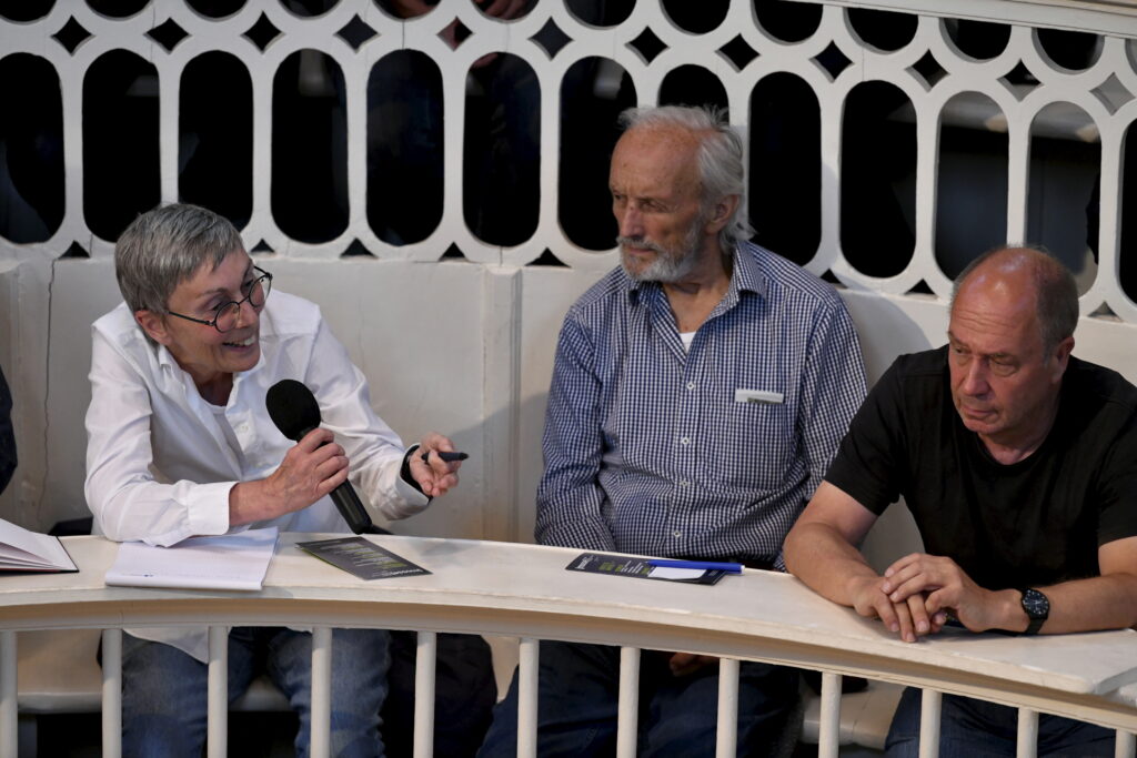 an audience member asks a question