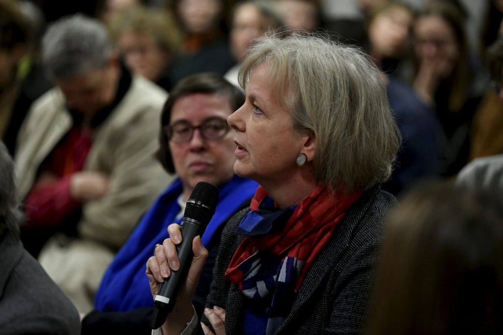 An audience member asks a question
