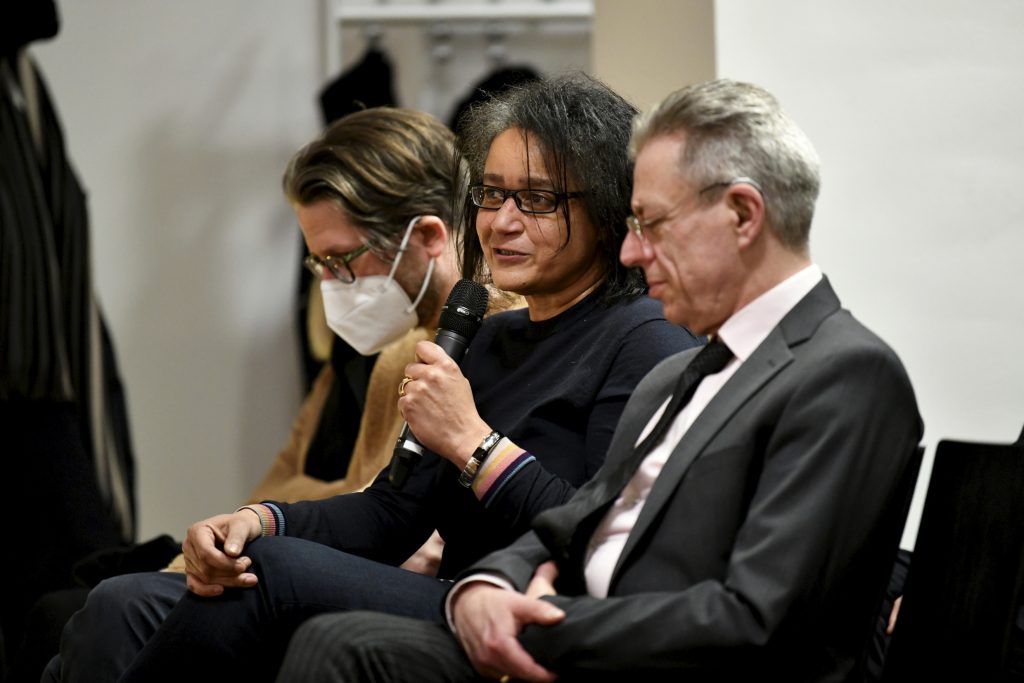 An audience member asks a question