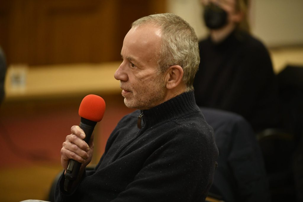 An audience member asks a question
