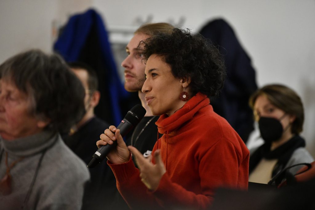 An audience member asks a question