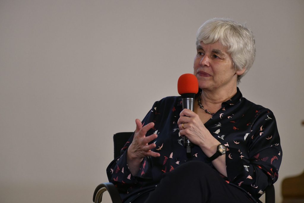 Janet Hartley speaks into the mic