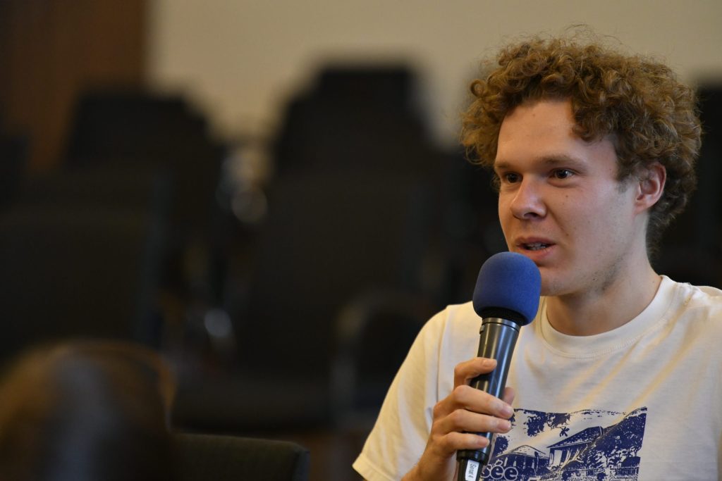 an audience member poses a question
