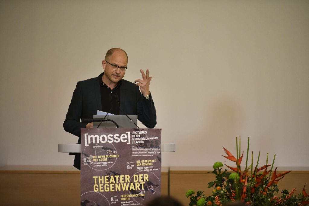 Stefan Willer speaks at the podium