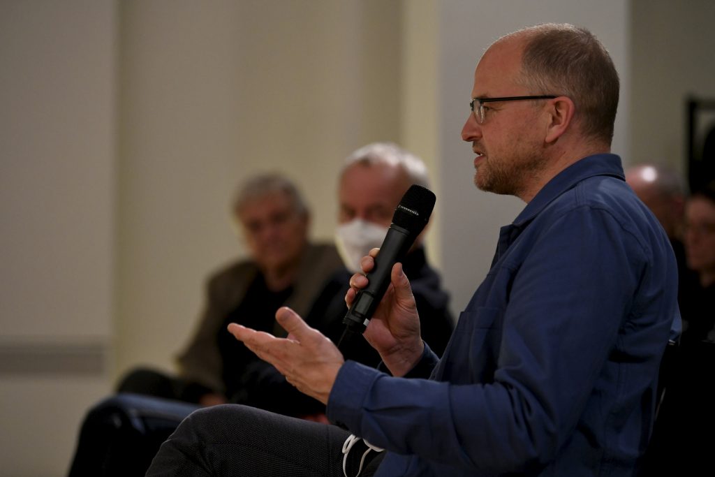 an audience member asks a question