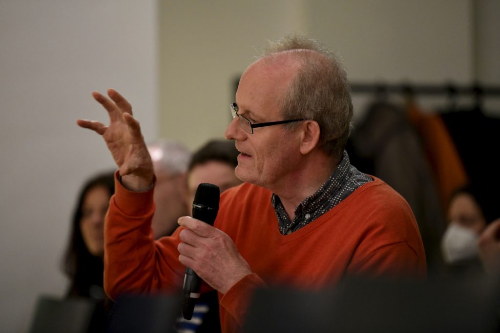 an audience member asks a question